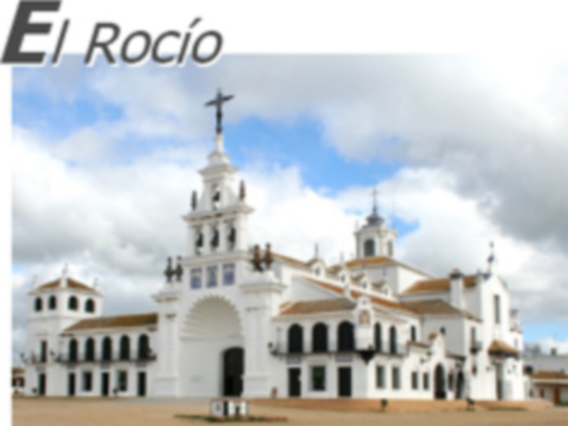 Iglesia de El Rocío, un santuario católico situado en Huelva, España, conocido por su importancia religiosa y tradiciones anuales.