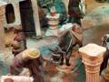 Representación escénica de la natividad, con figuras y animales en un entorno simbólico de la época.