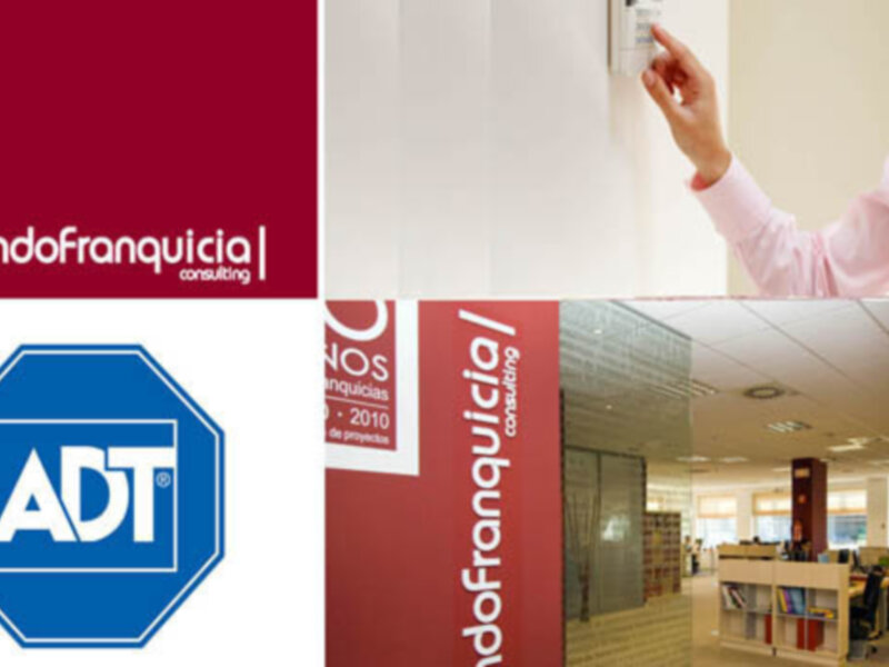 Oficina de ADT Consulting, con personal trabajando y logotipos visibles.
