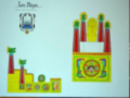 Un libro con el título "Los Mayas" muestra un diseño colorido de una estructura maya, incluyendo elementos arquitectónicos y decorativos típicos de la cultura maya.