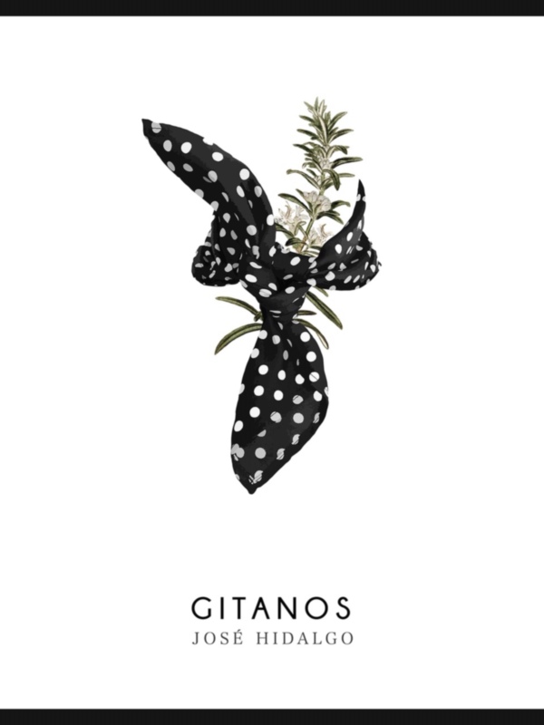 Un elegante broche de flores de rose con un lazo de seda negra con lunares blancos, diseñado por Gitanos.