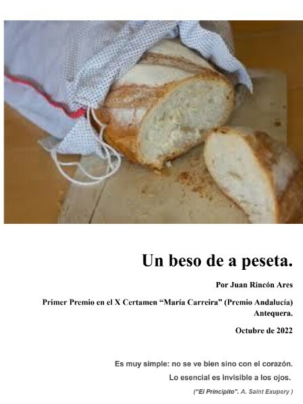 Un pan recién cortado, simbolizando el premio en el Certamen "María Carreira" de Antequera, octubre de 2022.