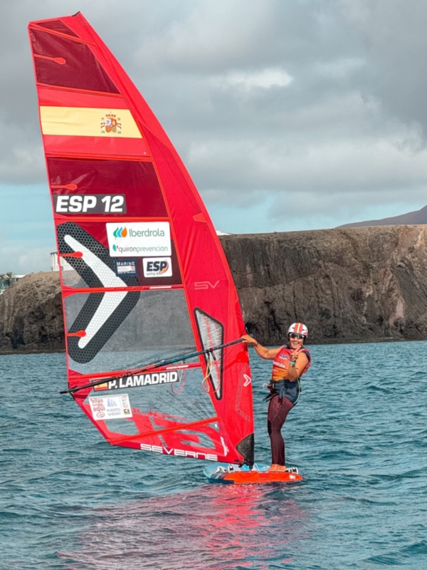Sailor enjoying windsurfing on a cloudy day in the Canary Islands.