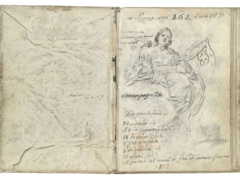 Un antiguo cuaderno abierto con dibujos y escritura manuscrita, posiblemente de un artista o escritor.