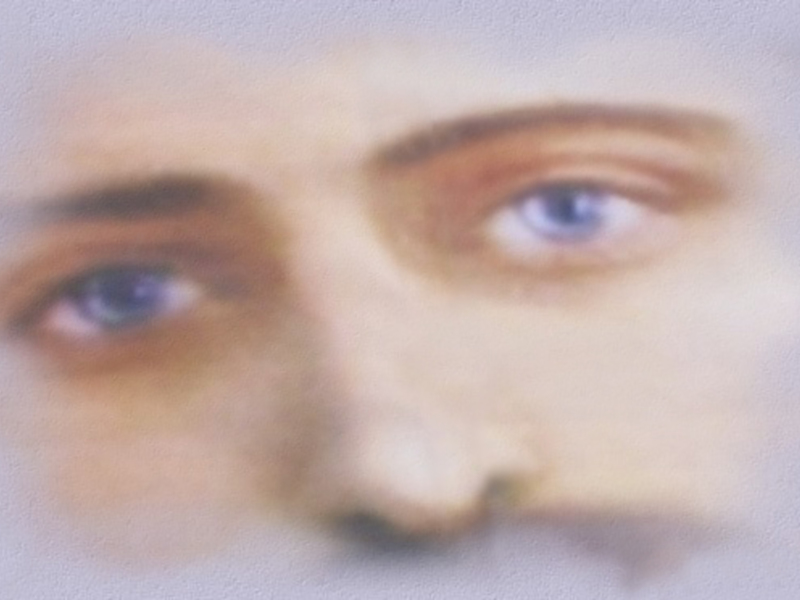 Imagen de un rostro humano con una expresión seria y pensativa.