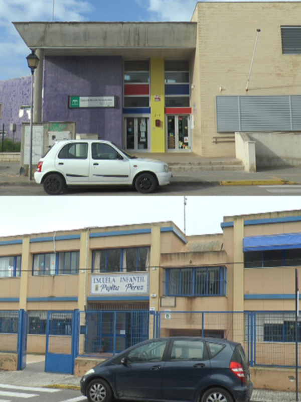 Fachada de un edificio con ventanas y puertas, en primer plano una calle con coches estacionados.